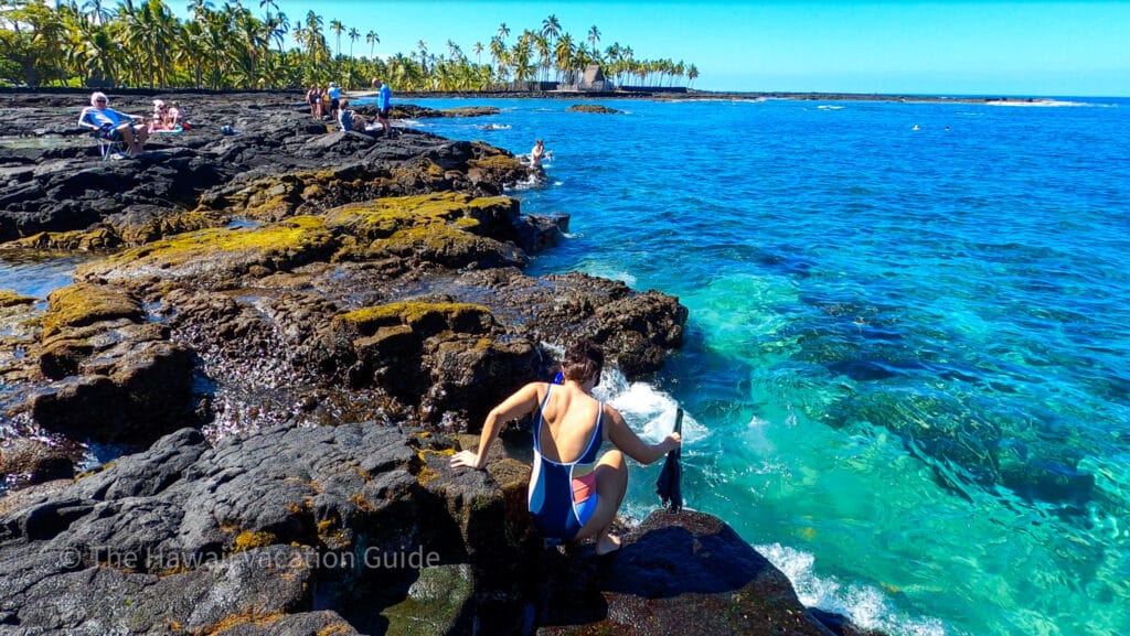 best snorkeling spots in Hawaii Two Step Big Island, Erica going into the water.