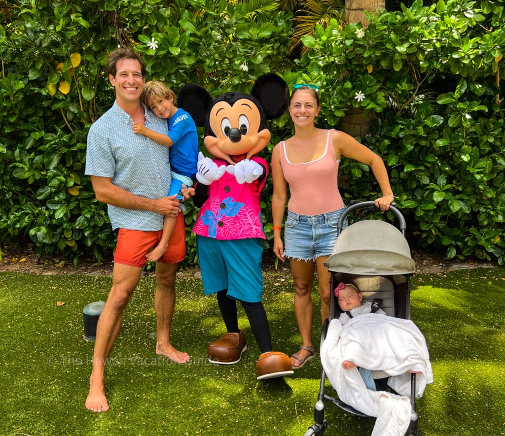A family photo with Disney's Mickey Mouse at the Aulani Disney Resort, one of the best family resorts in Hawaii