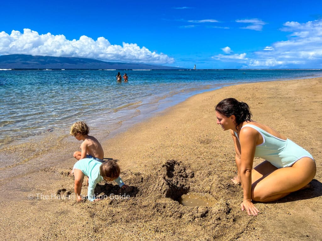 Booking a trip to Hawaii on the beach in Maui