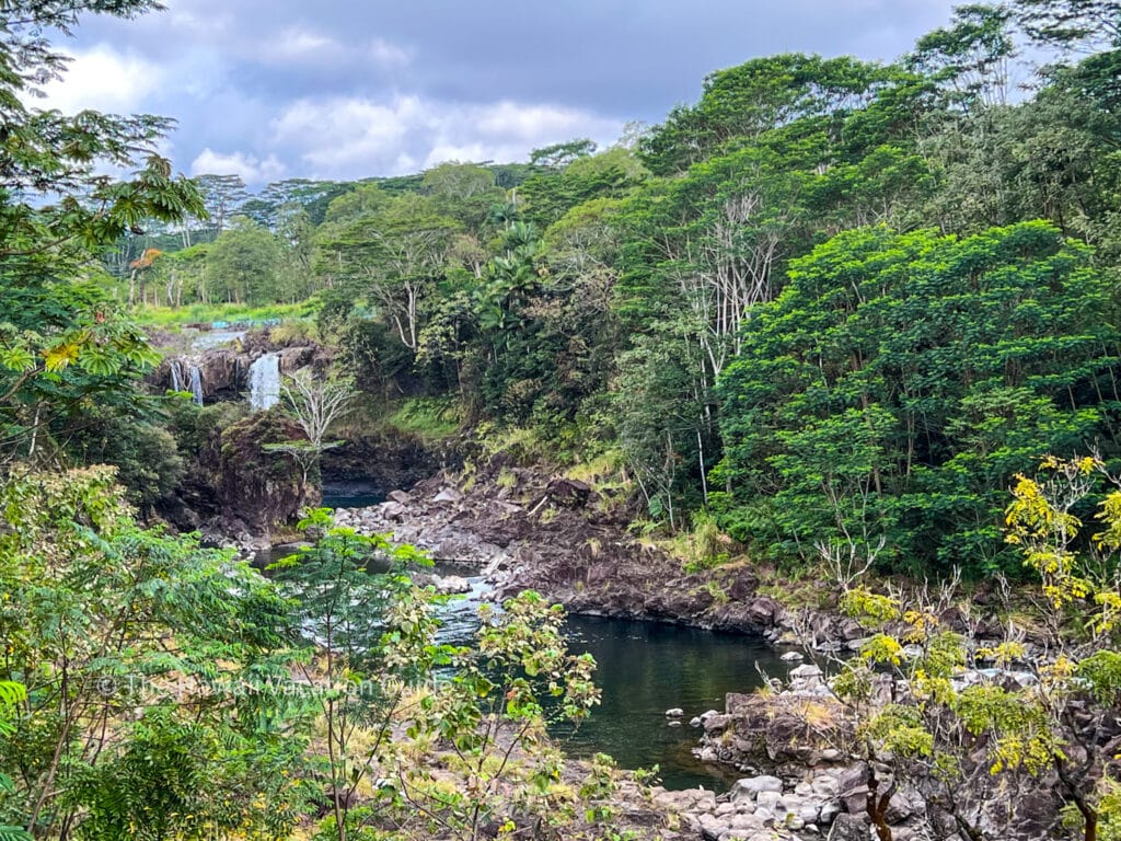 Big Island waterfalls, boiling pots, also known as Pe'epe'e Falls, which is set back a little farther among lush vegetation and a river.