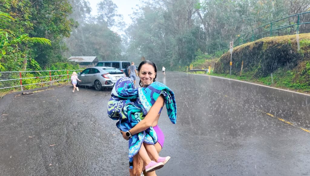 bad weather happens on a trip to hawaii. Erica in the rain